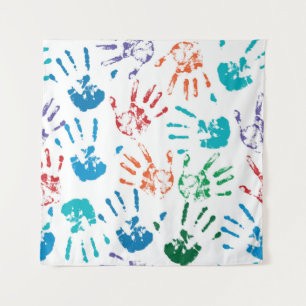 Seamless pattern of multicolored human hands on a tapestry