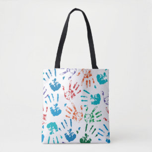 Seamless pattern of multicolored human hands on a tote bag
