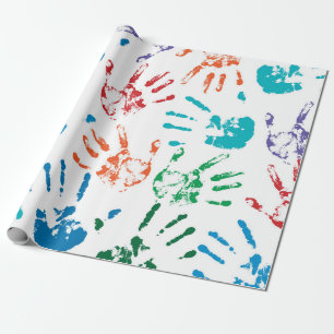 Seamless pattern of multicolored human hands on a  wrapping paper
