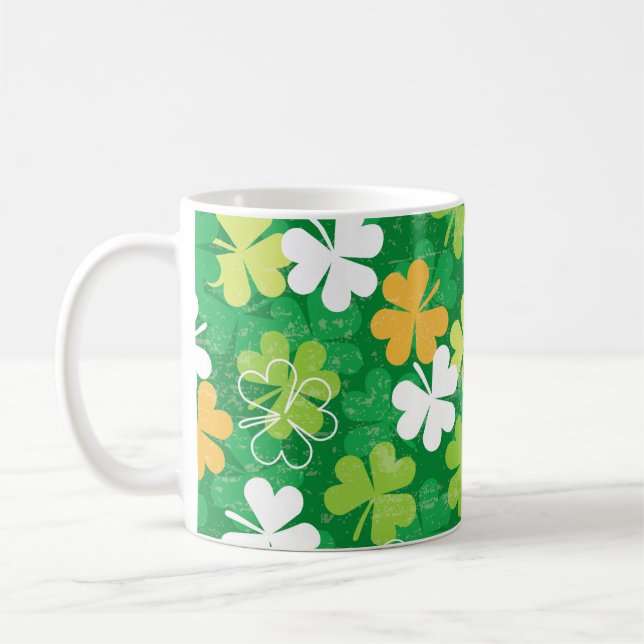 Seamless pattern of scattered clovers and shamrock coffee mug (Left)