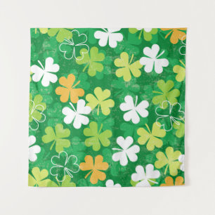Seamless pattern of scattered clovers and shamrock tapestry
