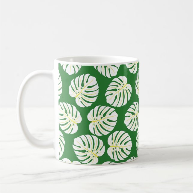 Seamless pattern of white monstera leaves on a dar coffee mug (Left)