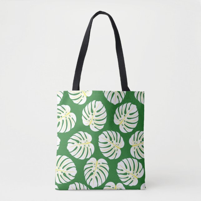 Seamless pattern of white monstera leaves on a dar tote bag (Front)