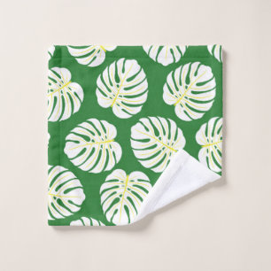 Seamless pattern of white monstera leaves on a dar wash cloth