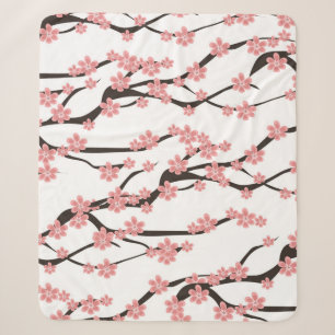 Seamless pattern with blooming cherry on a white b sherpa blanket