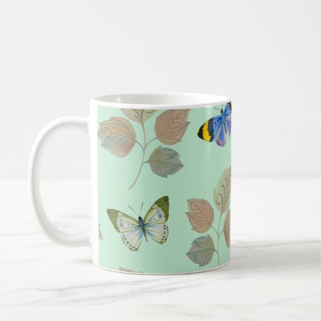Seamless pattern with bright butterflies and branc coffee mug (Left)
