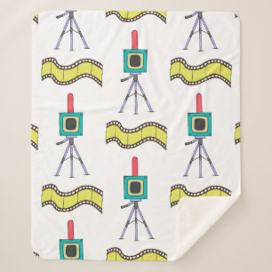 Seamless pattern with cameras and film strips on a sherpa blanket