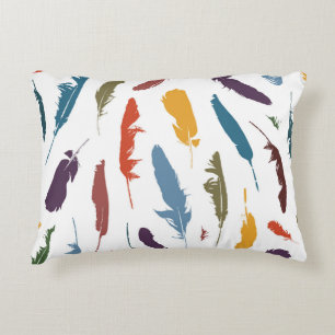 Seamless pattern with colored feathers on a light. decorative cushion