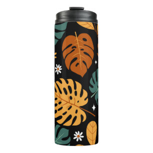 Seamless pattern with different tropical leaves an thermal tumbler