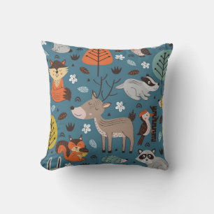Seamless pattern with forest animals on blue backg cushion