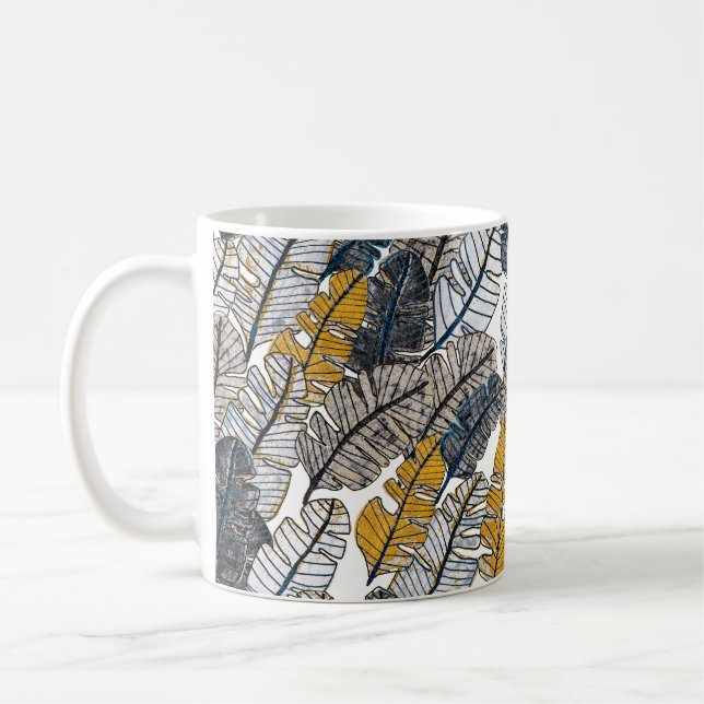 Seamless pattern with hand drawn tropical leaves. coffee mug (Left)