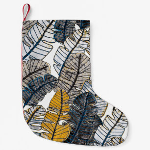 Seamless pattern with hand drawn tropical leaves. small christmas stocking