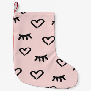 Seamless pattern with hearts and closed eyes small christmas stocking