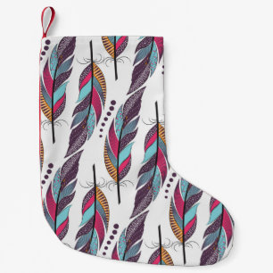 Seamless pattern with large colored feathers and d small christmas stocking