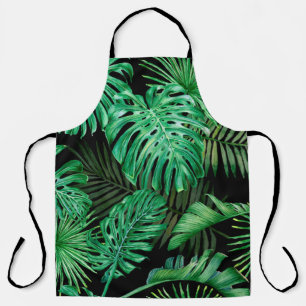 Seamless pattern with tropical leaves on a dark ba apron