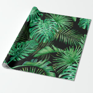 Seamless pattern with tropical leaves on a dark ba wrapping paper