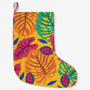 Seamless pattern with tropical leaves on yellow ba small christmas stocking