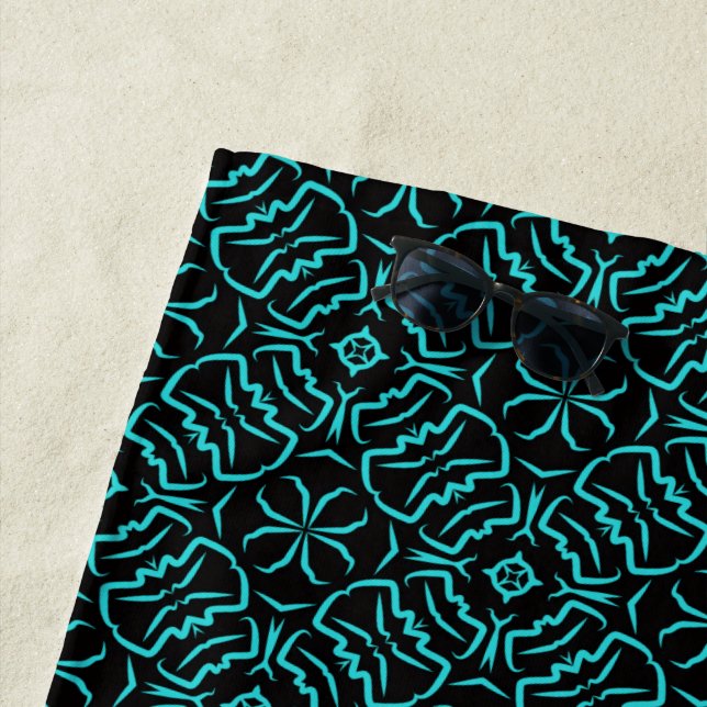Seamless Repeating Pattern In Turquoise On Black Beach Towel (In Situ)