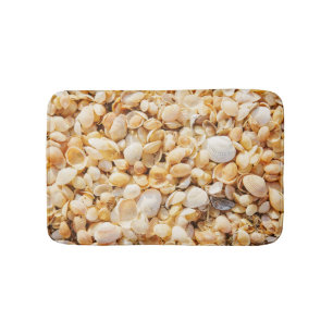 Seashell textured summer beach background. bath mat