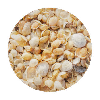 Seashell textured summer beach background. cutting board