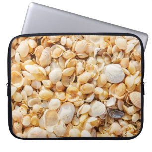 Seashell textured summer beach background. laptop sleeve