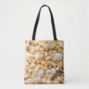 Seashell textured summer beach background. tote bag