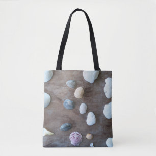 Seashells on an all-over printed tote bag