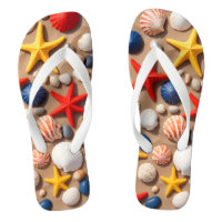 Seashells, starfish, and pebbles on a sandy beach