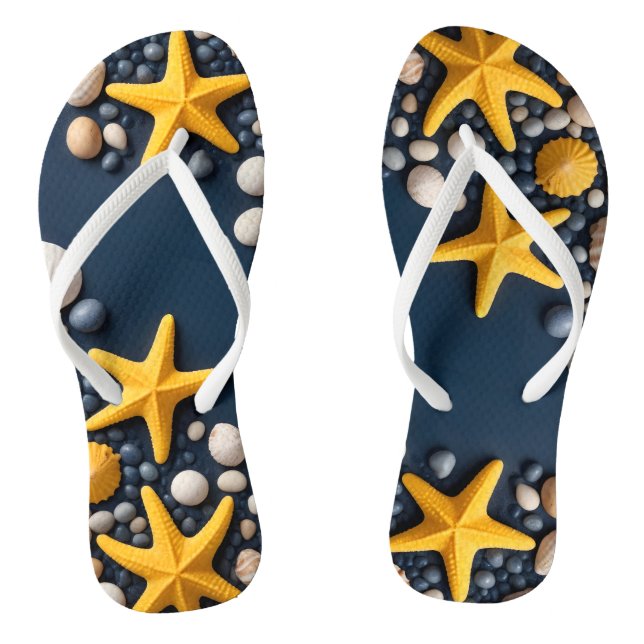  Seashells, starfish, and pebbles on a sandy beach Thongs (Footbed)
