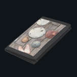 Seashore Treasures Trifold Wallet<br><div class="desc">Megan Meagher is known for her simple art pieces. This image captures the simplicity of the seashore's treasures, including sand dollars and seashells in a pastel coloured tone. Meagher encompasses a wooden background in her image to contrast these treasures. Get this fine art print today on wood colour on your...</div>
