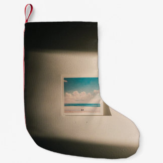 Seashore under cloudy sky in the morning photo small christmas stocking