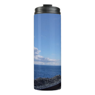 seaside and train track under blue sky thermal tumbler