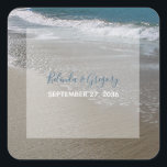 Seaside Beach & Sand Wedding Square Sticker<br><div class="desc">This beach design features a sandy coastline. The picturesque setting combines blue ocean, white crashing waves and golden sand. The text is elegantly framed with a simple white opaque border background. This is the perfect beach destination wedding design ideal for a summer or seaside wedding. Elegant and romantic beach wedding...</div>