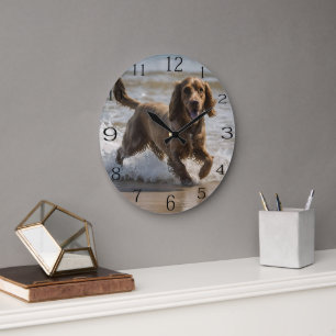 "Seaside Fun: A Cocker Spaniel Play in the Ocean Large Clock