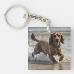 "Seaside Fun: Cocker Spaniel at Play in the Ocean Key Ring