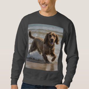 "Seaside Fun: Cocker Spaniel at Play in the Ocean Sweatshirt