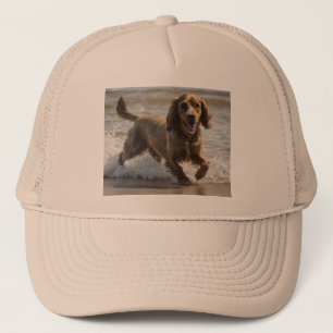 "Seaside Fun: Cocker Spaniel at Play in the Ocean Trucker Hat