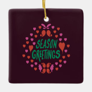 Season greetings in green handwriting with hearts ceramic ornament