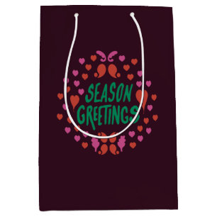 Season greetings in green handwriting with hearts medium gift bag