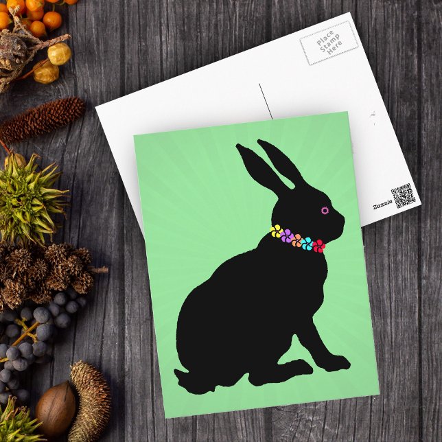 Seated Black Rabbit in Silhouette Pretty Flowers Postcard (Sitting black silhouette Easter or Spring time rabbit wearing flowers on green postcard.)