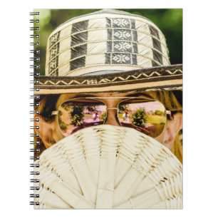Selective focus photo of woman wearing aviator sun notebook