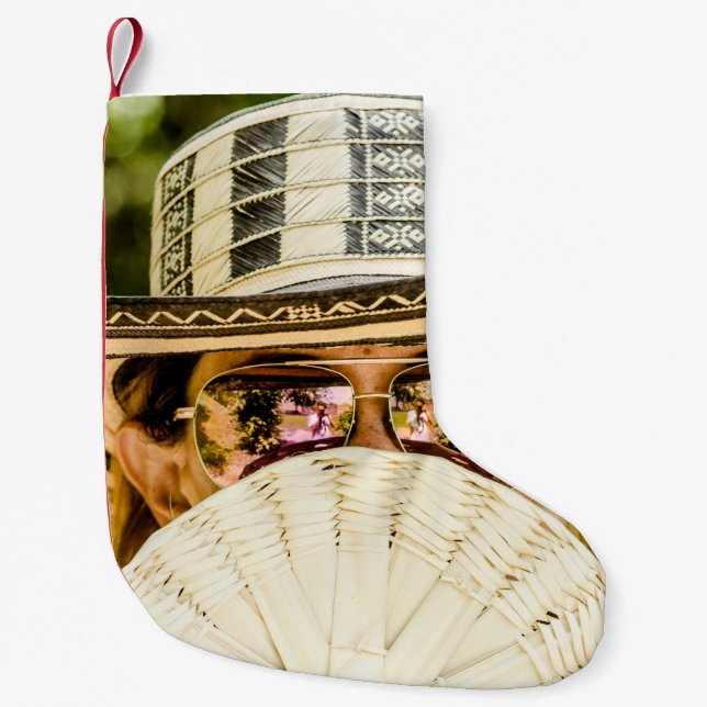 Selective focus photo of woman wearing aviator sun small christmas stocking (Front)