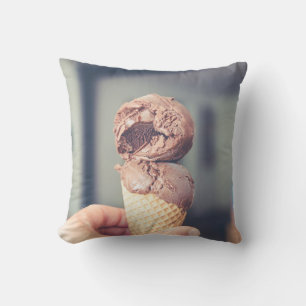 Selective focus photography of chocolate ice cream cushion