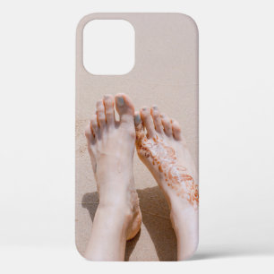 Selective focus photography of feet with tattoo on iPhone 12 case
