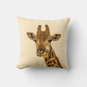 SELECTIVE FOCUS PHOTOGRAPHY OF GIRAFFE CUSHION