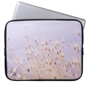 SELECTIVE FOCUS PHOTOGRAPHY OF GRASS FIELD LAPTOP SLEEVE