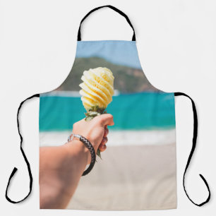 Selective focus photography of person holding frui apron