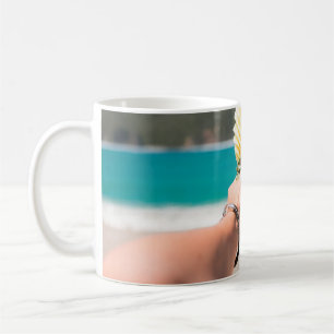 Selective focus photography of person holding frui coffee mug