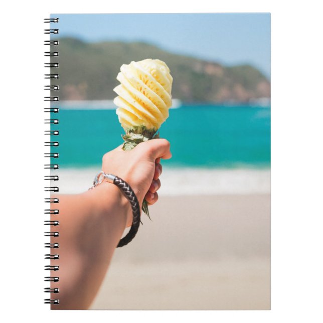 Selective focus photography of person holding frui notebook (Front)