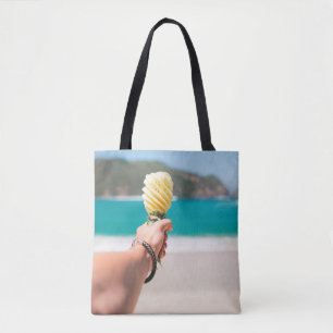 Selective focus photography of person holding frui tote bag